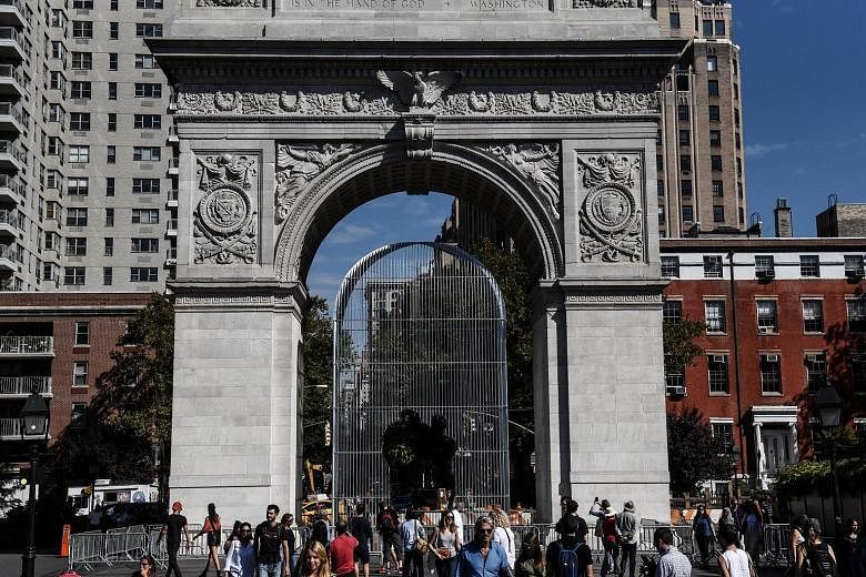 Another sculpture (left) is constructed under the Washington Square Arch (left below). One of Ai Weiwei's sculptures for his project, Good Fences Make Good Neighbours, near Central Park in New York City.