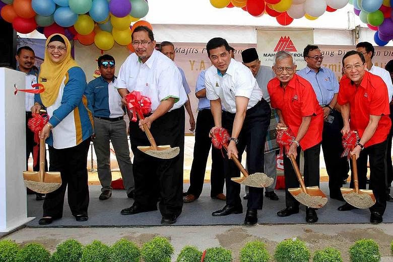 Selangor Menteri Besar Azmin Ali (third from far left) at the groundbreaking ceremony for a building project. He is reported to have gone overseas recently to market the state to foreign investors.