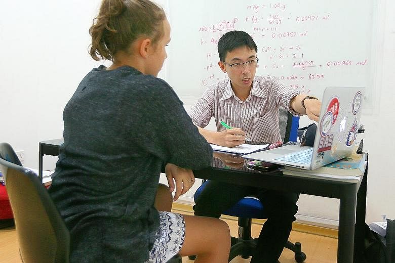 Mr Shaun Lim of Student's Inn teaching an international student last Thursday. From 15 foreign students taking tuition for the International Baccalaureate examination in 2004, the centre now has about 300 of them.