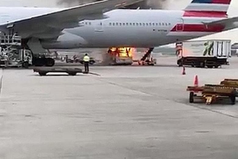 A fire broke out on the tarmac of Hong Kong International Airport yesterday, with black smoke seen billowing near the belly of an American Airlines plane. The blaze began at around 5.30pm in one of the parking berths and one person was injured, polic