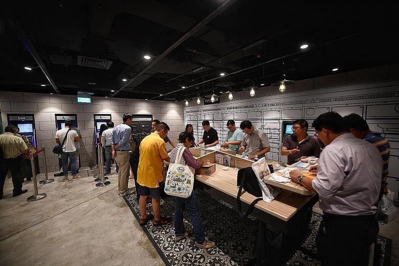 The self-service area of the General Post Office in the redeveloped SingPost Centre in Paya Lebar, which was officially launched yesterday. The self-service area is accessible at all hours and has POPStation lockers, upgraded SAM machines and a self-