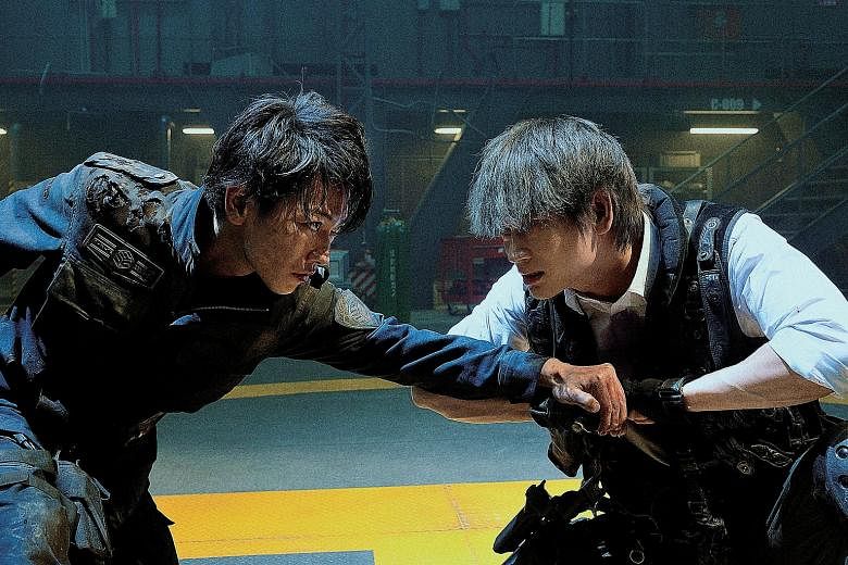 Kei Nagai (Takeru Satoh, left) faces off with his fellow Ajin, Sato (Go Ayano), in Ajin: Demi-Human.