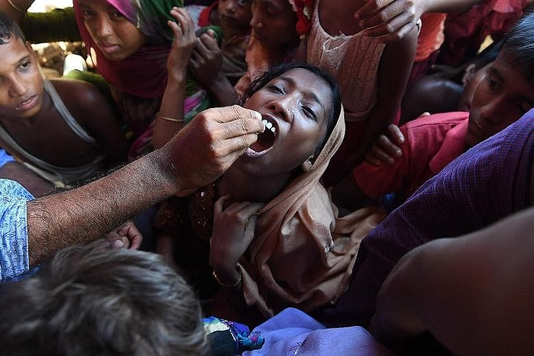 A Rohingya refugee receiving an oral cholera vaccine at a refugee camp in Ukhia district, Bangladesh. The United Nations launched one of its biggest cholera vaccination drives in the refugee camps of south-east Bangladesh yesterday amid fears of an o
