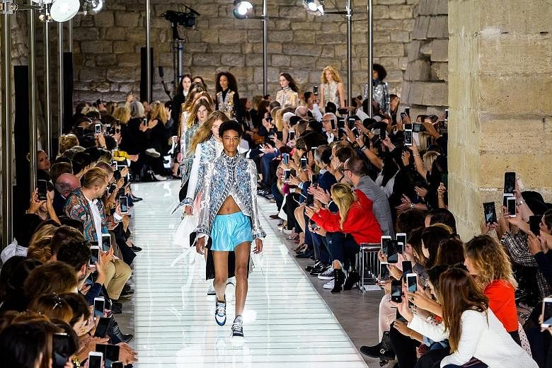 Models presenting French designer Nicolas Ghesquiere's Spring/Summer 2018 Ready to Wear collection for LVMH fashion house Louis Vuitton during Paris Fashion Week earlier this month.