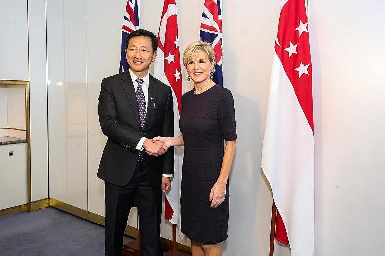 Mr Ong Ye Kung with Australia's Foreign Minister Julie Bishop on Tuesday. He also visited the Australian War Memorial and laid a wreath in honour of Australian soldiers who sacrificed their lives, including during the defence of Singapore in World Wa