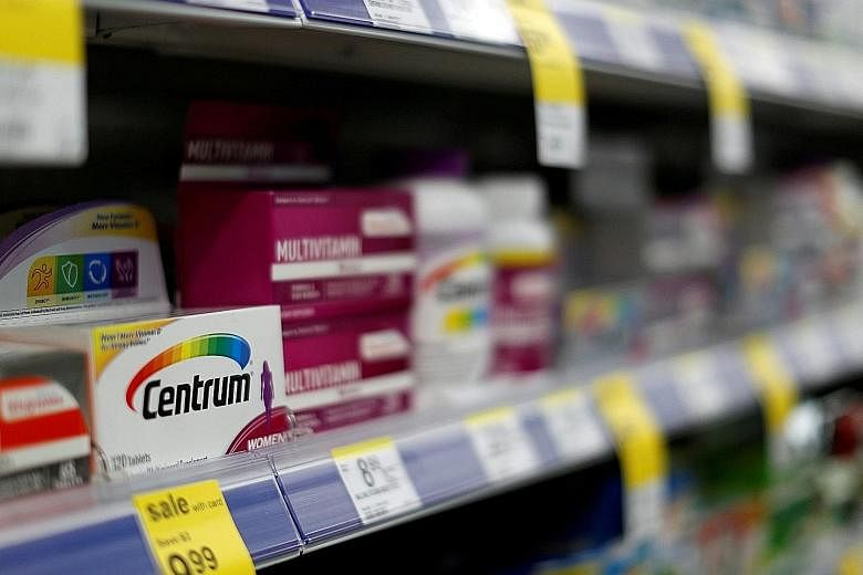 Centrum vitamins, a Pfizer brand, at a store in the US. Pfizer's consumer healthcare business, whose brands include painkiller Advil and lip balm ChapStick, had revenue of about US$3.4 billion (S$4.6 billion) last year.