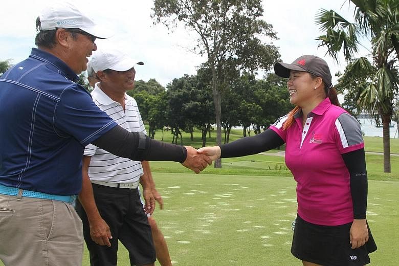 Former national golfer and YGP alumna Joey Poh meeting donors at yesterday's fund-raiser at Sentosa Golf Club.