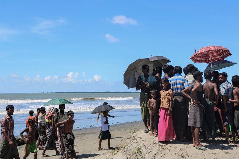 Rohingya refugees near Gaw Du Thar Ya village in Maungdaw, in northern Rakhine, waiting to cross the border to Bangladesh. The writer says that dismissing the Rohingya as Bengalis squatting on Myanmar soil, as the Myanmar authorities are wont to do, 