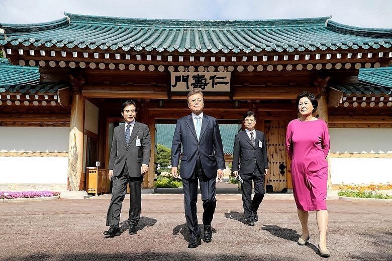 South Korean President Moon Jae In (centre) and his wife, Kim Jung Sook, outside the presidential Blue House in Seoul on May 15. Mr Moon will visit South-east Asia next month - his first to the region since he took office in May.
