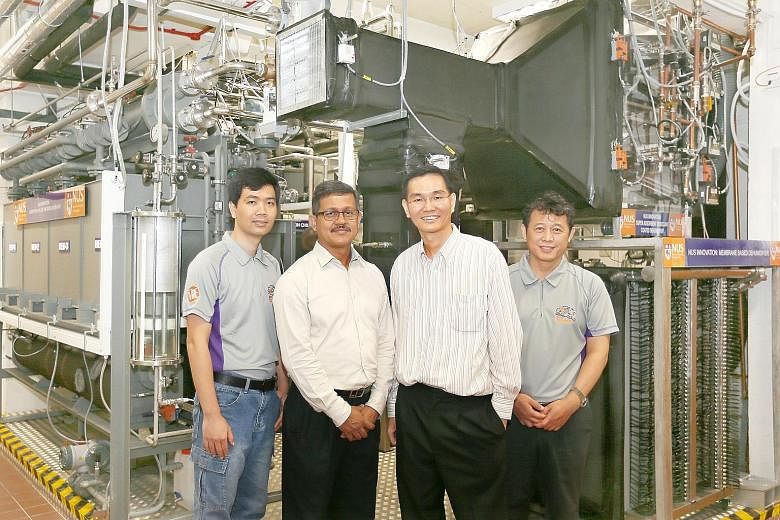 Members of the NUS engineering team behind the quad-generation plant (from left) Dr Bui Duc Thuan, research fellow; Dr Md Raisul Islam, senior lecturer; Associate Professor Ernest Chua; and Dr M Kum Ja, senior research fellow.