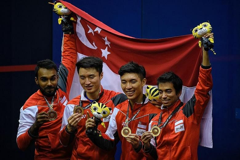 From left: Vivian Rhamanan, Pang Ka Hoe, Benedict Chan and Samuel Kang showing off their gold medals on the podium after pipping the Philippines 2-1 to win the SEA Games men's squash team final at the Nicol David Arena. Singapore won two more golds i