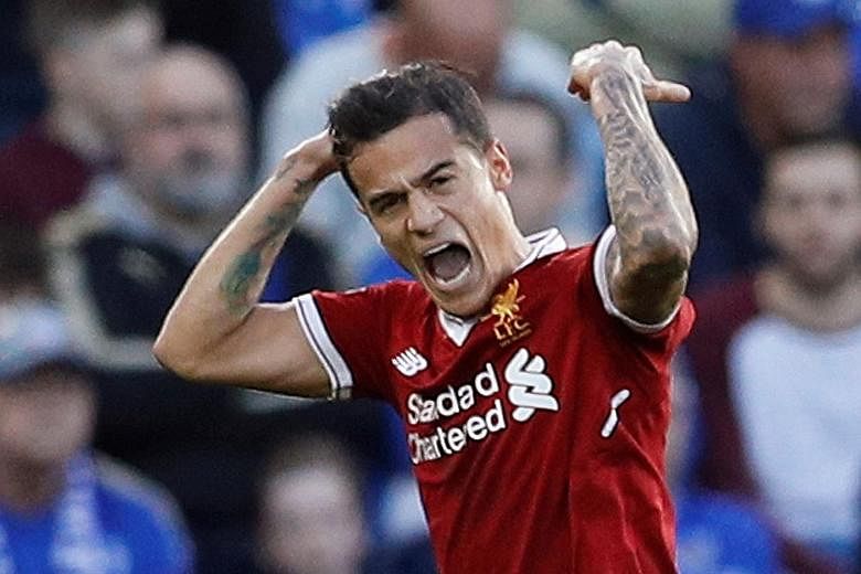 Philippe Coutinho celebrating after scoring the second goal in Liverpool's 3-2 Premier League victory over Leicester on Sept 23. Despite the failed transfer bid, he is still a target for Barca.