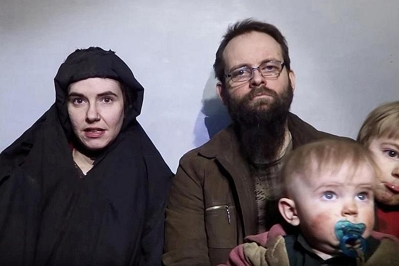 A still image from a video posted by the Taleban on social media in December last year showing American Caitlan Coleman, her Canadian husband Joshua Boyle and two of their children. The couple were kidnapped in 2012 during a backpacking trip in Afgha