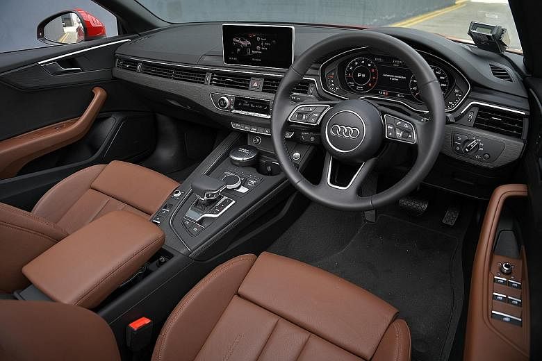 The A5 Cabriolet's top opens in 15 seconds and closes in 18 seconds; its dashboard is modern and classy.