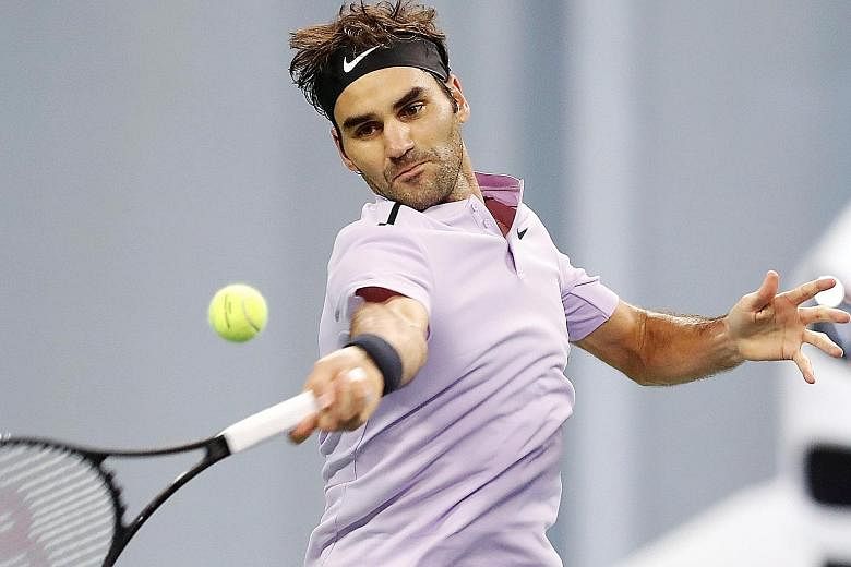 Roger Federer hits a forehand during his 3-6, 6-3, 6-3 win against Juan Martin del Potro in the Shanghai Masters semi-final yesterday.