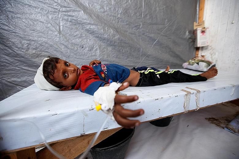 Cholera-stricken Siddique Nuruddin Ali, seven, at a treatment centre in the Red Sea port city of Hodeidah last Sunday. The cholera outbreak in war-torn Yemen is the largest single-year cholera outbreak on record, United Nations spokesman Stephane Duj
