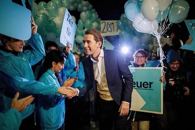 Mr Sebastian Kurz, who became Austria's foreign minister at the age of 27, greeting supporters in Vienna last Tuesday. The leader of the centre-right Austrian People's Party will have to reassure the migrant population that he can pull back from the 