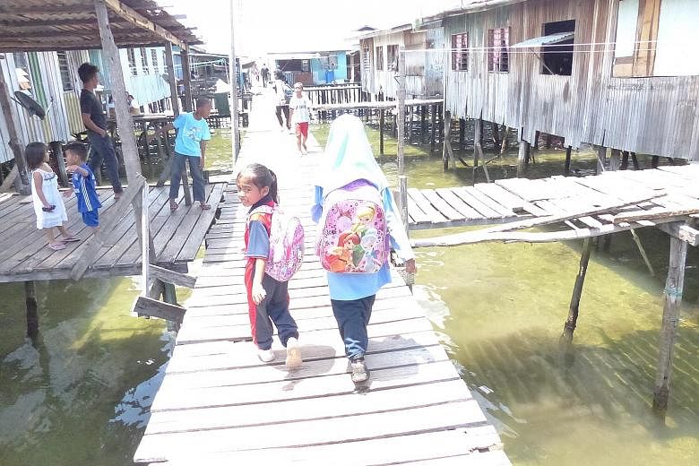 Parti Warisan Sabah leader Shafie Apdal (left) must contend with Umno's Tan Sri Musa Aman, Sabah's Chief Minister, who is credited for his effective management of the state's economy. Kampung Pasir Putih, the enclave of stilt houses on an island just