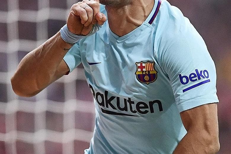 Barcelona forward Luis Suarez celebrating his late equaliser against Atletico Madrid on Saturday. The table toppers had their seven-game winning streak halted by a resolute Atletico side playing at their new Wanda Metropolitano home.