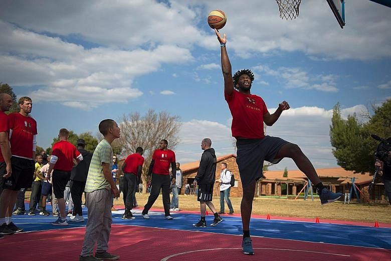 Philadelphia 76ers centre Joel Embiid demonstrating a lay-up to children during a basketball practice clinic before the NBA Africa Game 2017 in August. The injury-prone Cameroonian, who recently signed a new five-year deal extension, has played only 