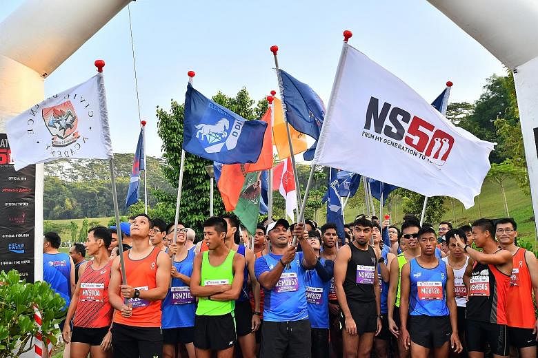 To celebrate 50 years of national service, a 100-strong flag contingent of operationally ready national servicemen and runners from Special Olympics Singapore took part in the 22nd edition of the HomeTeam NS Real Run yesterday. The 14 Special Olympic