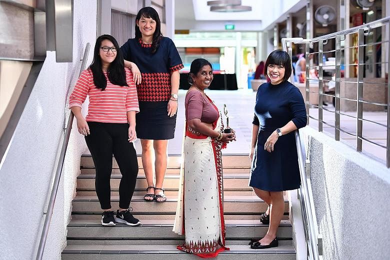 The Foreign Domestic Worker of the Year award went to Ms Jayawardena Mudiyanselage Sittamma Jayawardena, seen here with members of the Chua family: (from left) student Ho Hui Min, 16; her mother Irene Chua, 47, a teacher; and Ms Corinne Chua, 42, a l