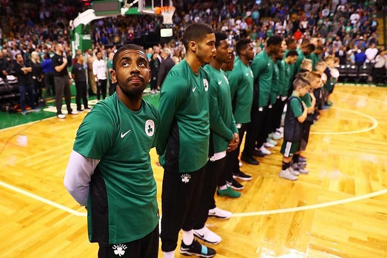 Kyrie Irving (extreme left) of the Boston Celtics initiated the trade request to leave the Cleveland Cavaliers and is now the centre of attention before the season-opener against his old team.