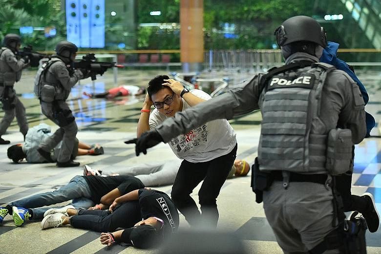 Changi Airport came under a "terror attack" early this morning - and multiple agencies dealt successfully with the threat - all as part of Exercise Northstar. In this photo taken during a media preview last week, police officers can be seen directing