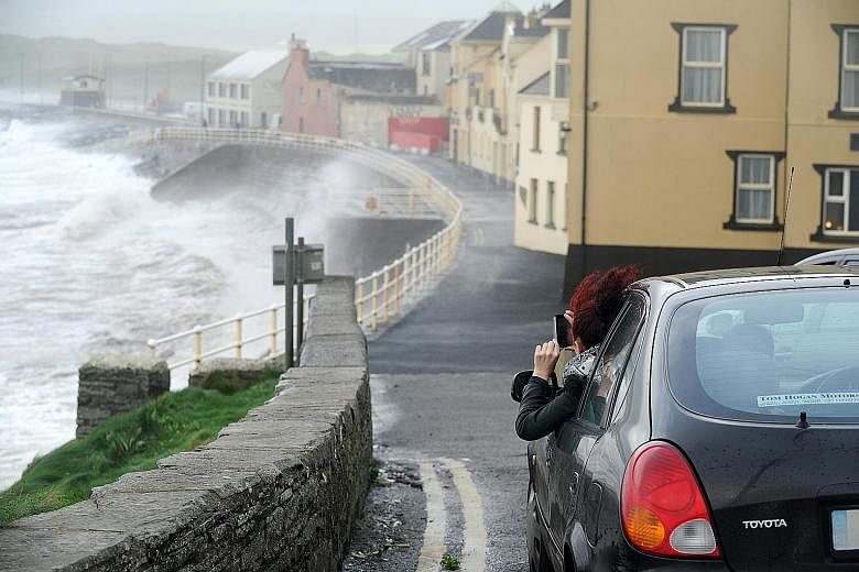 As Ophelia battered the Atlantic coast of Ireland in Lahinch village, County Clare, yesterday, Britain's met service put an Amber Weather Warning into effect for Northern Ireland, saying the storm posed a danger to life.