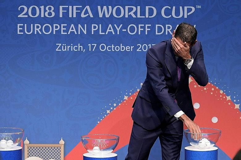 Retired Spanish footballer Fernando Hierro doing the honours at the World Cup European play-off draw yesterday in Zurich.