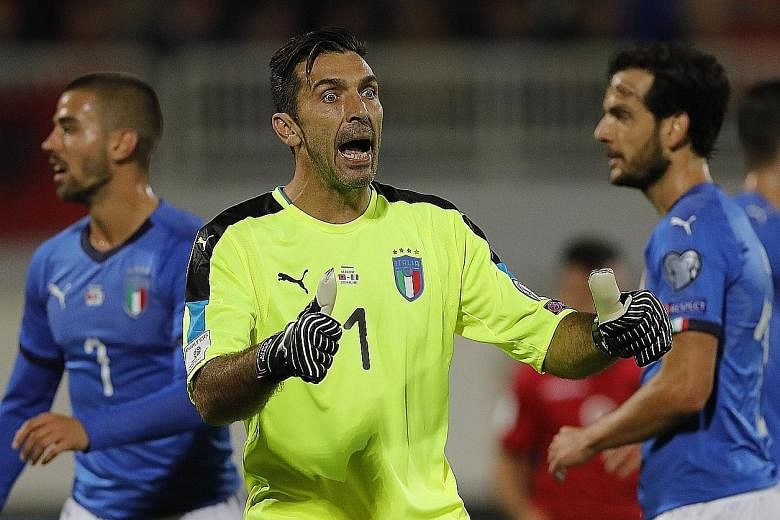 Gianluigi Buffon, the 39-year-old Italy captain, encouraging his team-mates during the World Cup qualifier against Albania in Shkoder. The Azzurri won 2-0 to finish behind Spain and will be reasonably confident of reaching the Finals.