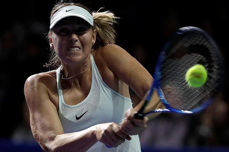 Maria Sharapova (above) of Russia in action against Magdalena Rybarikova of Slovakia in the Kremlin Cup first round in Moscow yesterday. Rybarikova had to grind her way to victory, likening the atmosphere to that for the Fed Cup.
