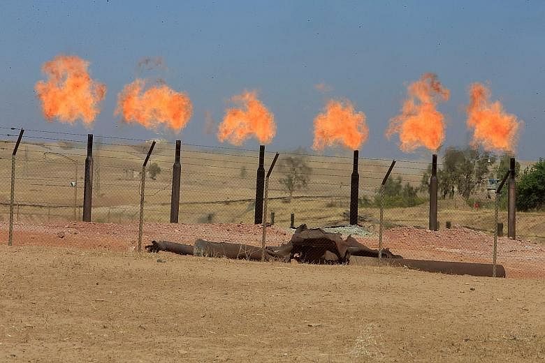 Oil fields on the outskirts of Kirkuk, Iraq. Crude was flowing from Kirkuk 10 years before Saudi Arabia struck oil.