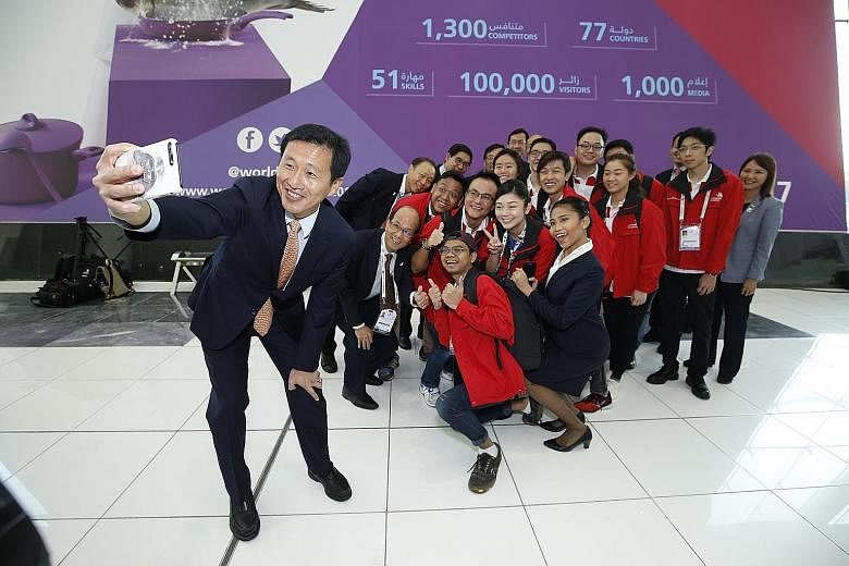 Education Minister (Higher Education and Skills) Ong Ye Kung with Singapore competitors and management staff from the polytechnics and Institute of Technical Education at the 44th international WorldSkills competition in Abu Dhabi, United Arab Emirat