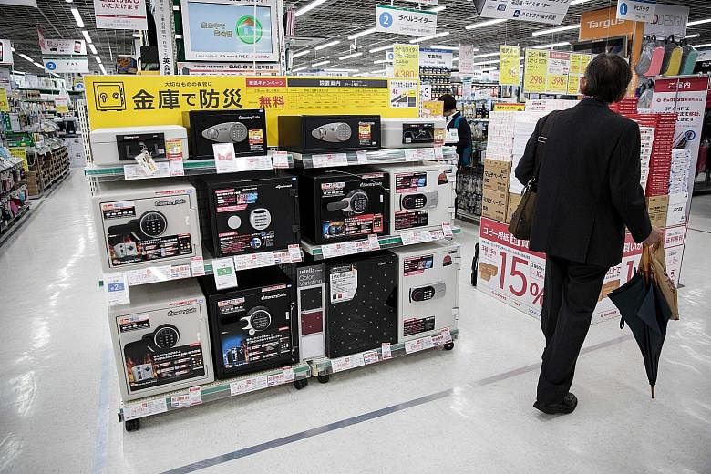 Sales of home safes are booming as Japanese look to stash cash at home, partly to avoid scrutiny by tax officials.