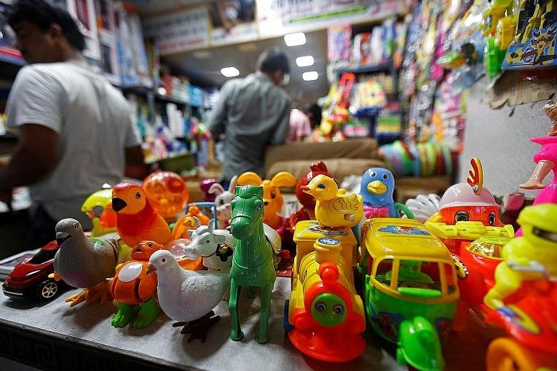 A shop selling made-in-China toys at a market in India's Kolkata. For India's toy retailers, who import everything from toy cars to musical phones and even robots from China, new requirements on quality set by New Delhi meant supply disruptions befor