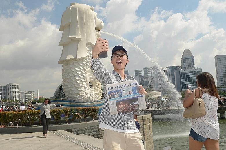 ST reader Justin Tan, 26, a teacher, taking a selfie at the Merlion Park during a treasure hunt. He is one of five winners who could meet world No. 1 Simona Halep tomorrow and hopes to bring a photo he took with her in 2014 to be autographed.