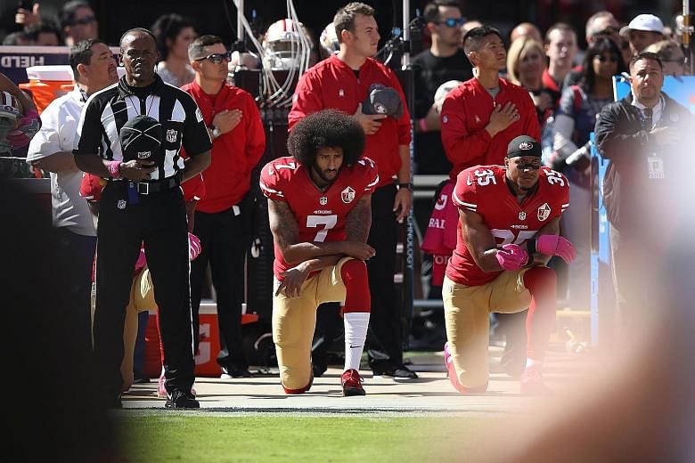 Former San Francisco 49ers quarterback Colin Kaepernick "taking a knee" last October before his NFL game against the Tampa Bay Buccaneers in protest at the racial inequality in the US and police treatment towards African Americans.