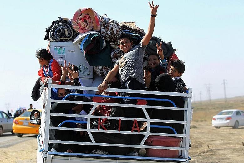 Displaced Iraqis, who fled from Hawija in 2014 to Kirkuk, making their return to Hawija yesterday, after the town was retaken by government forces. Prime Minister Haider al-Abadi said on Tuesday that the Sept 25 vote for Kurdish independence was now 