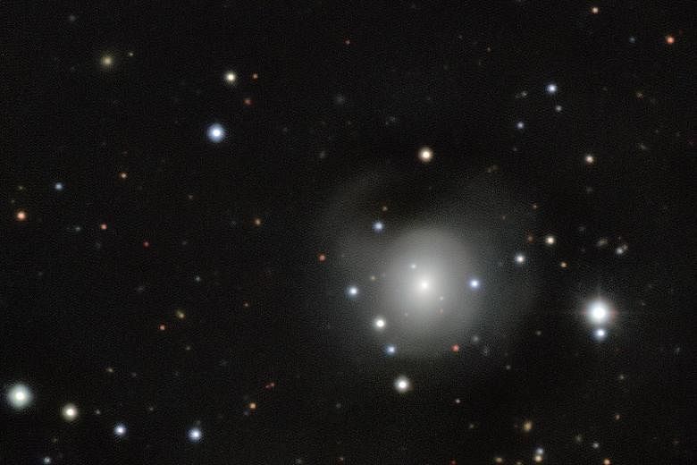 An image released on Monday showing a spot of light recorded by European Southern Observatory telescopes in Chile. Scientists have come up with a theory of colliding neutron stars to explain the observation.