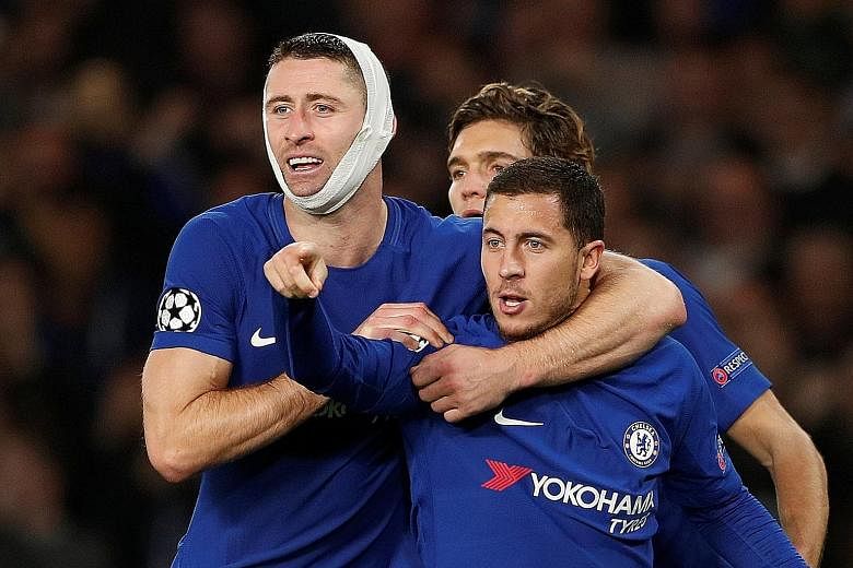 Chelsea's Eden Hazard (front) celebrating his 75th-minute equaliser against Roma with captain Gary Cahill and Marcos Alonso, which gave the Blues a point on Wednesday. They threw away a two-goal lead, and with two league losses in a row and N'Golo Ka