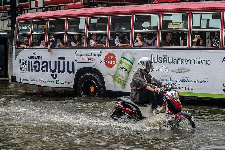 A flooded street in Bangkok last Saturday. Last weekend, the capital was drenched by rainfall not seen in over 20 years. 22 Thai provinces that have been flooded in at least one district, according to a report issued by the Royal Irrigation Departmen
