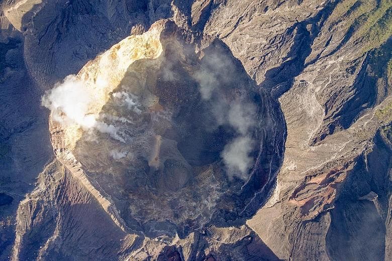 A view of Mount Agung volcano's crater on the Indonesian island of Bali. Thousands of residents who fled when the volcano's alert status was raised are refusing to leave evacuation centres to return to their homes outside the immediate danger zone.
