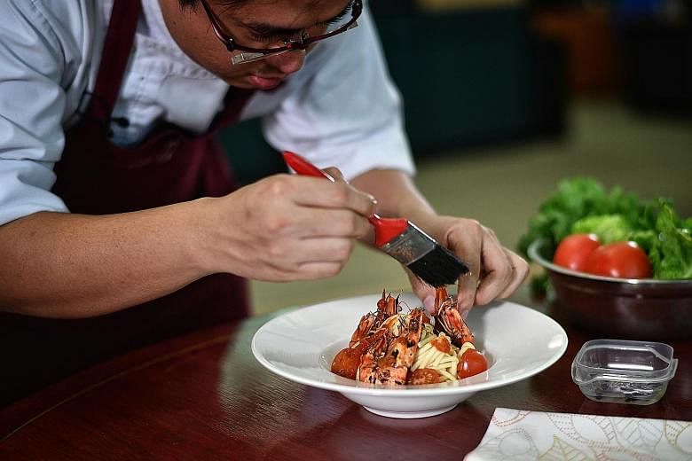 Mr Tan Chun Rong, who made the switch from food photography about a year ago, styling a plate of handmade udon at home.