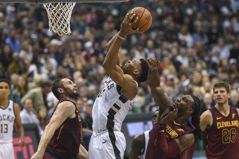 Giannis' big night lifts Bucks over Kings as tempers flare late