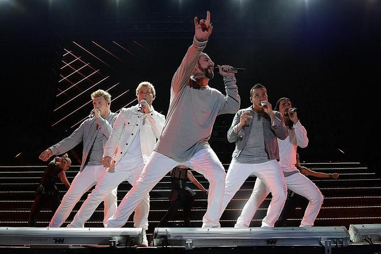Backstreet Boys (comprising from left, Nick Carter, Brian Littrell, AJ McLean, Howie Dorough and Kevin Richardson) charmed fans with familiar songs and dance routines.