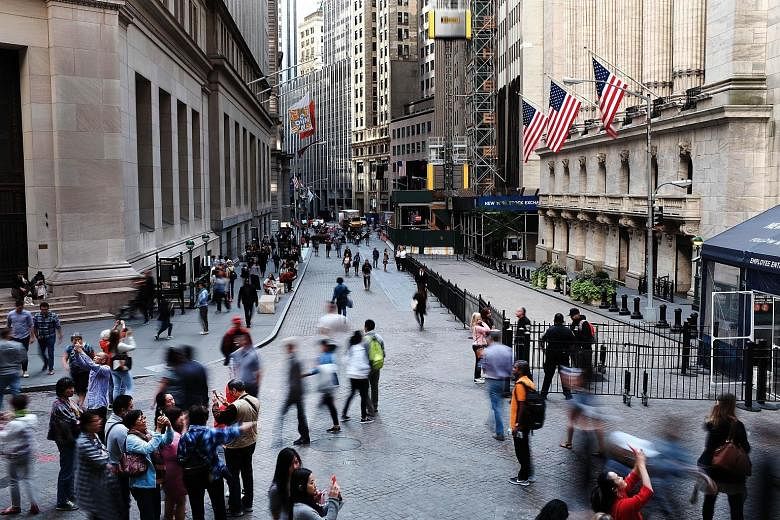 The New York Stock Exchange in Manhattan. Buoyed by resurgent global trade and economic growth, Wall Street is now in the second longest bull market in US history, with the Dow up 27 per cent in the past year and 250 per cent since it bottomed out in
