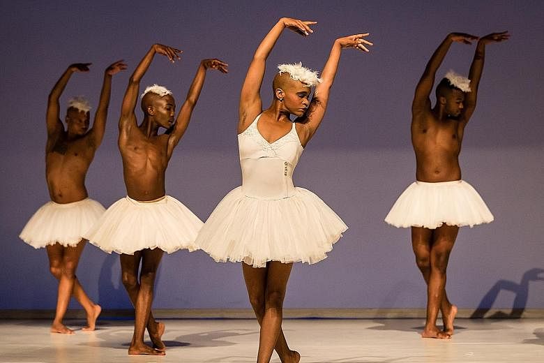 Dada Masilo's (in front) Swan Lake opens with all the dancers, male and female, clad in white tutus and striking balletic poses before they launch into an African dance.