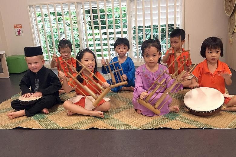 Pre-schoolers from My First Skool learning about the cultures of different races. Researcher Setoh Pei Pei is working on a project, involving at least 300 children from 30 My First Skool centres, to come up with materials for pre-schools, such as des