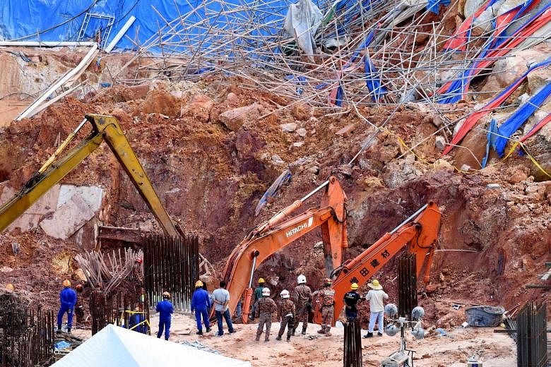 The authorities in Penang had initially said 13 foreign workers and a Malaysian supervisor were trapped under a landslide at a construction site last Saturday. But they clarified yesterday that the total number of workers buried was 11, as three work